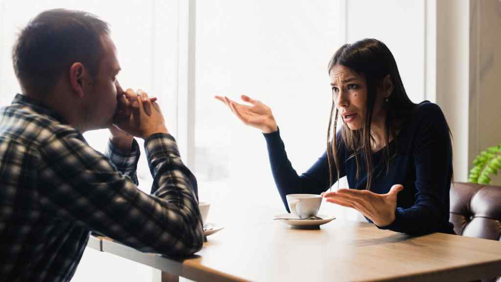 Young couple arguing in a cafe. Relationship problems (romankosolapov)