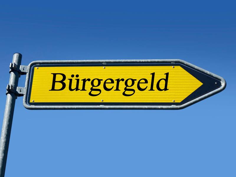 Ein gelbes Schild mit der Aufschrift "Bürgergeld"